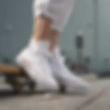 All-white Converse shoes on a skateboard, highlighting their cultural significance