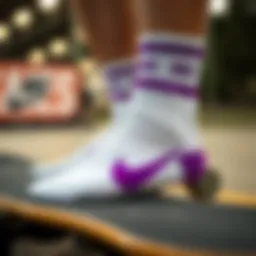 Stylish close-up of white and purple Nike socks paired with skateboard