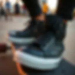 Close-up of black Converse shoes on a skateboard