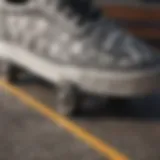 A close-up view of gray checkered Vans on a skateboard deck, showcasing their grip and design.