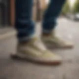 A stylish pair of khaki Vans on a skateboard