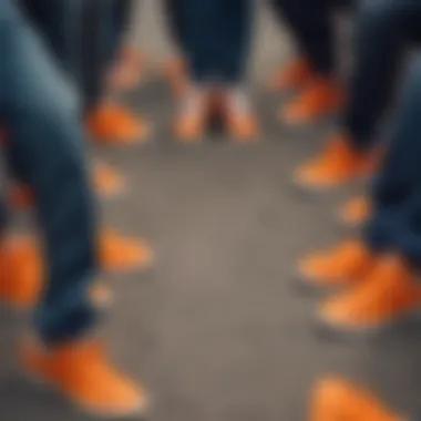 Group of skateboarders showcasing their orange Adidas Shell Toes