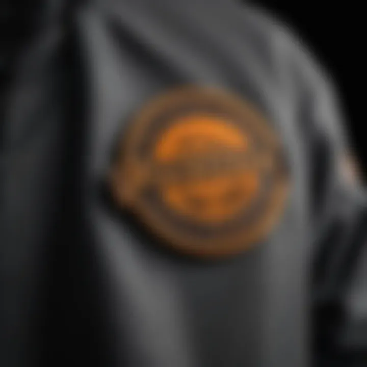 A close-up of the design elements and branding on the Primitive skate jacket.