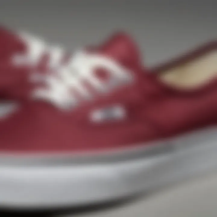 Close-up of the maroon colorway on Vans Authentic sneakers