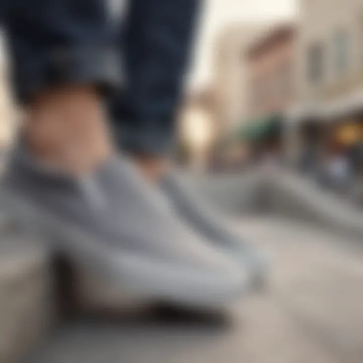 Grey slip-on Vans worn by a skater on a ramp, highlighting their functional aspect