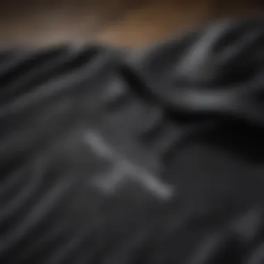 Close-up of a high-quality black hoodie showcasing texture and design