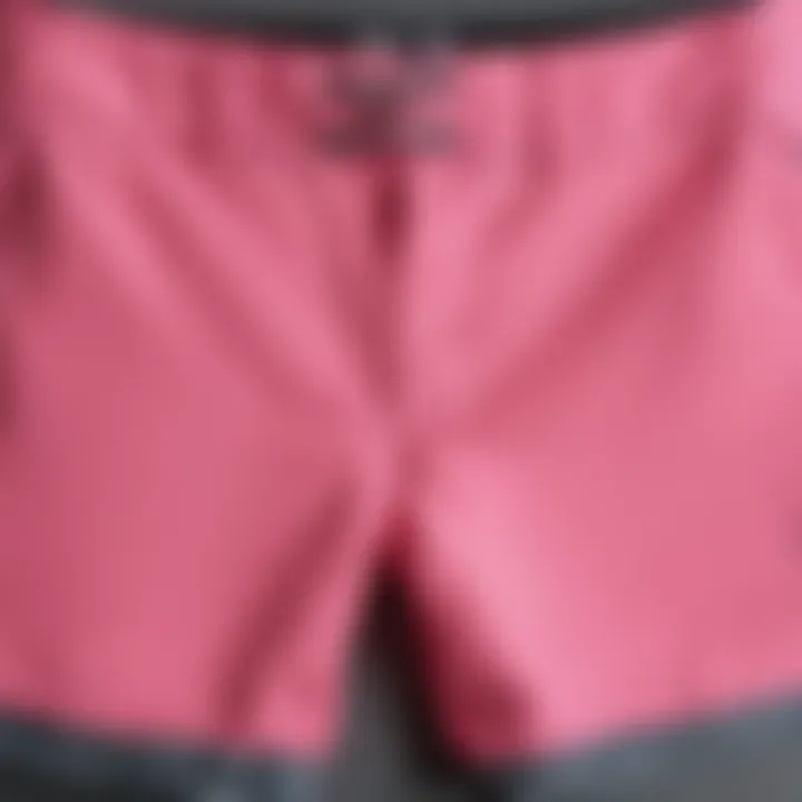 Detail of the fabric and functionality of Hurley pink board shorts.