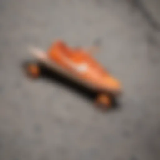 Vibrant orange Nike skateboard deck against a textured concrete backdrop