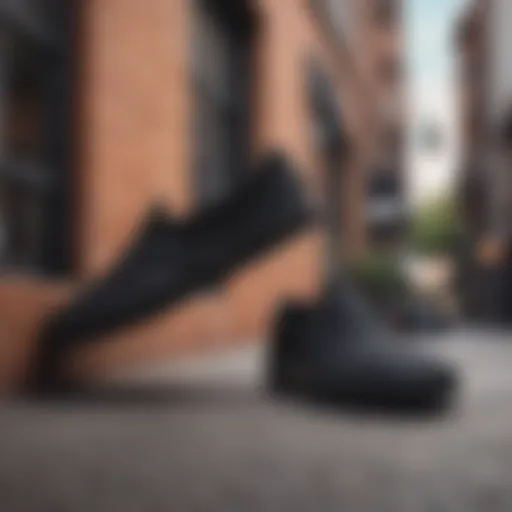 Stylish all black slip-on Vans showcased against a vibrant urban backdrop