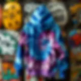 A vibrant blue tie dye hoodie hanging against a skateboard backdrop.
