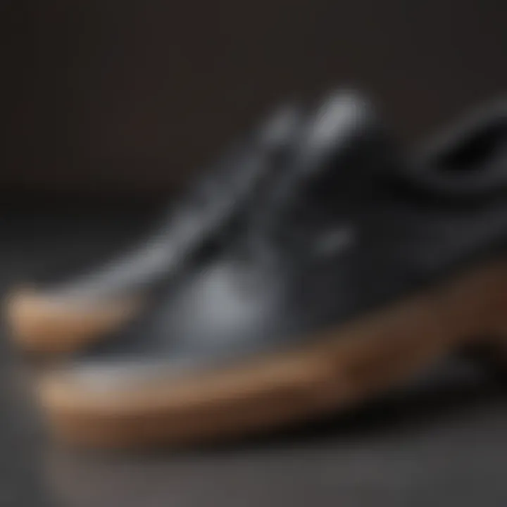 Close-up of gum sole detailing on black Vans sneakers