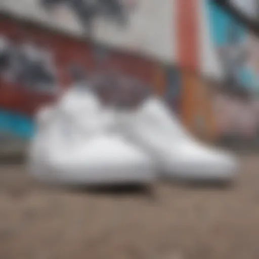 A pair of white Vans positioned against a graffiti wall, symbolizing punk culture.