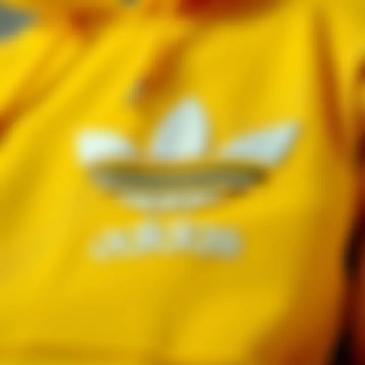 Fabric Focus: Details of the Yellow Adidas Hoodie Close-up of the fabric texture and branding of the yellow Adidas hoodie