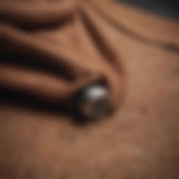 Close-up of a textured brown hooded sweatshirt hanging on a skateboard