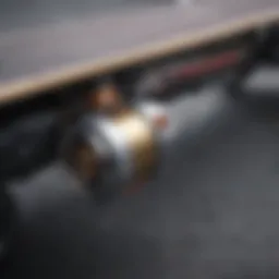 Close-up view of an electric skateboard motor mounted on a truck